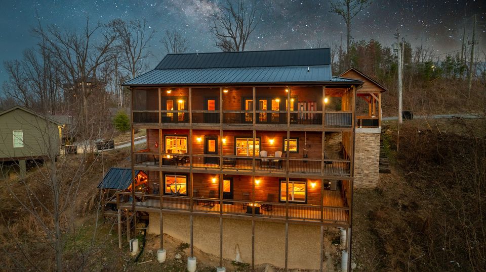 Three stories of lit decks at dusk