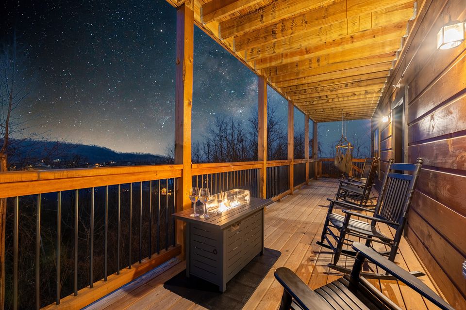 Covered deck with rocking chairs under the stars
