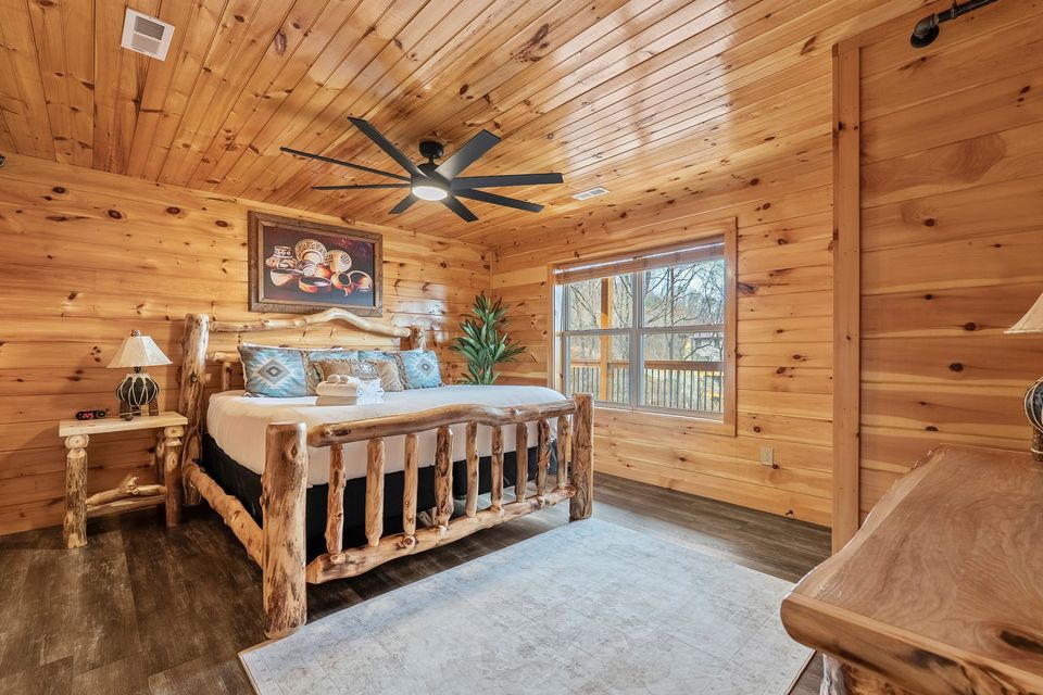 King log bed with mountain decor