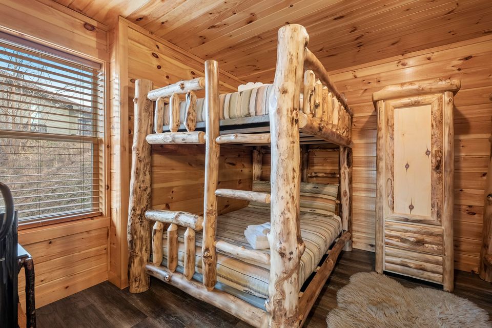 Bunk room with two log bunk beds