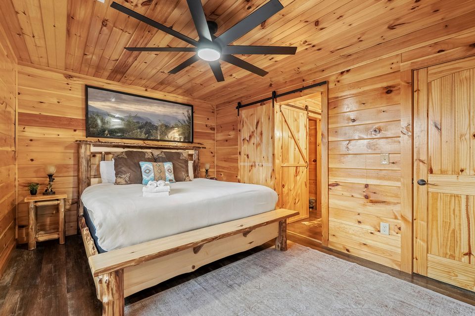 King bedroom with sliding barn door