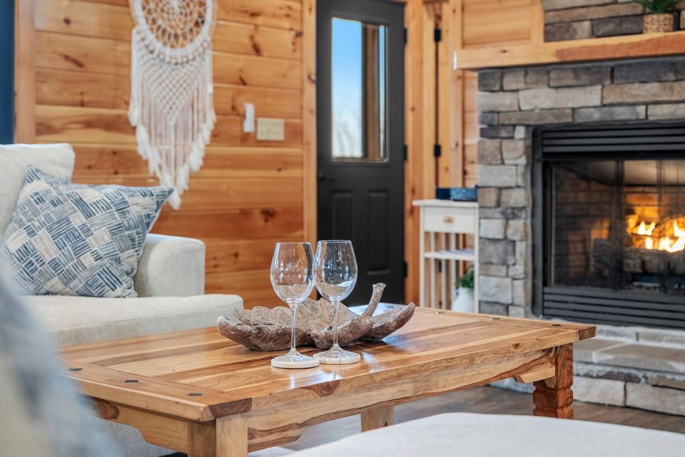 Gas fireplace with wine glasses on the coffee table