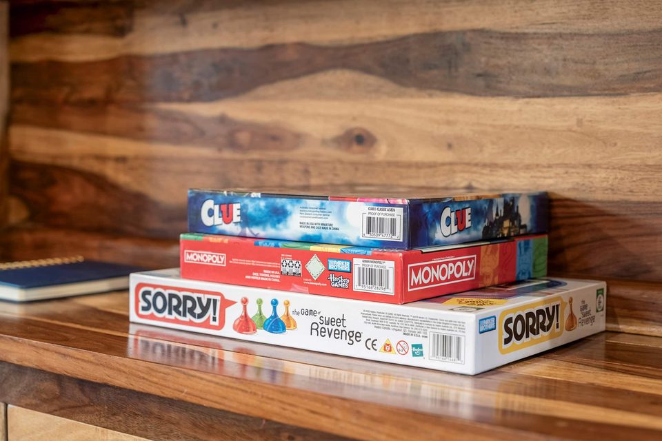 Board games stacked on a wood table